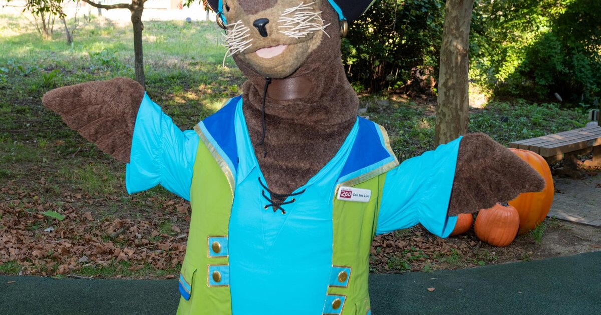 Costumed Character Ambassadors greeting families during Boo at the Zoo