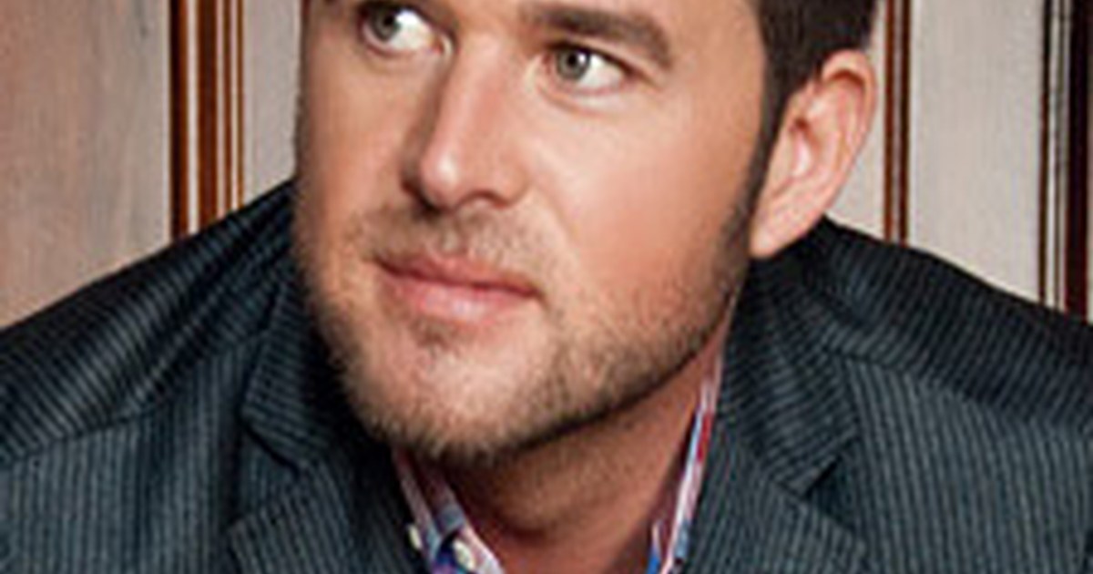 Country artist spotlight on a small indoor stage