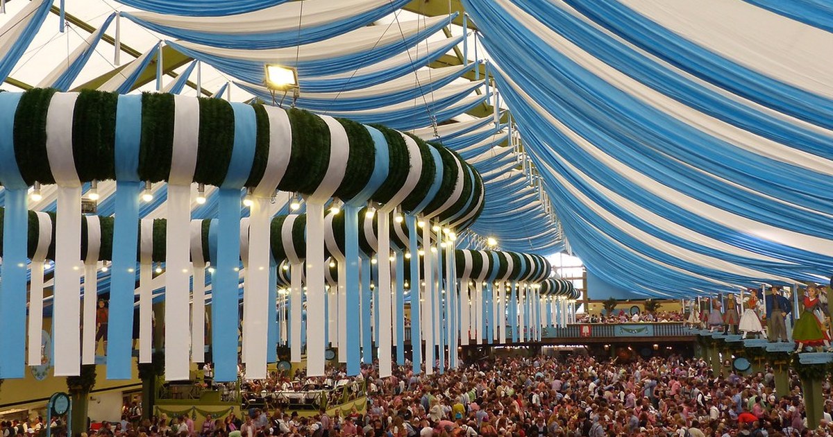Oktoberfest beer garden tables with pretzels and steins
