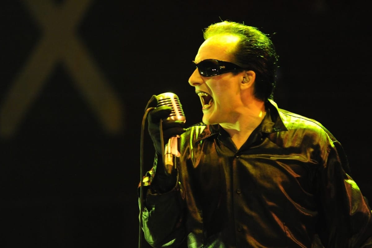 Dave Vanian of The Damned performing live with a vintage microphone