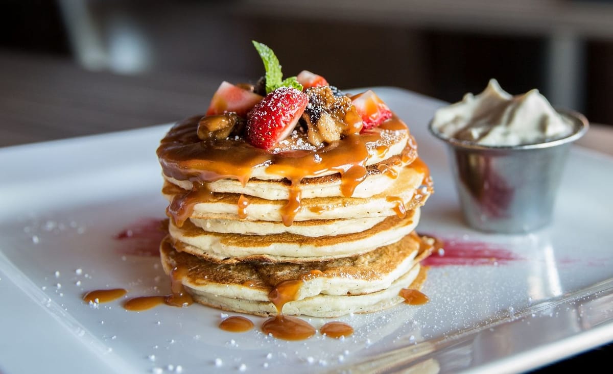 Pancakes and berries on a plate for a Columbus brunch