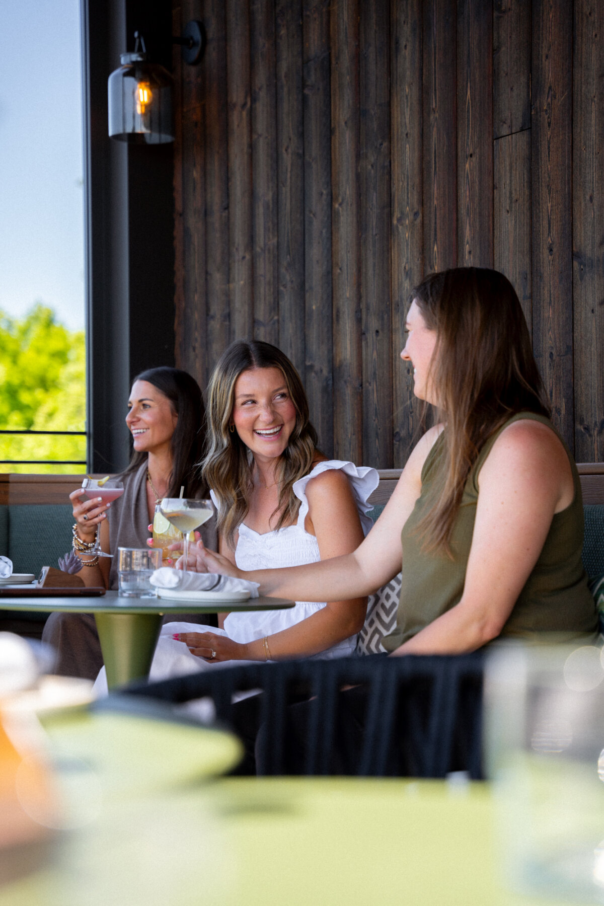 Patio drinks and conversation at a Columbus-area rooftop lounge (Lani)