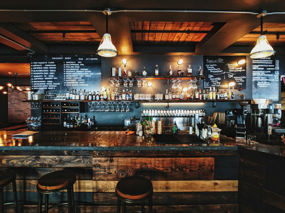 Evening drinks at a Columbus bar patio for a happy hour by neighborhood guide