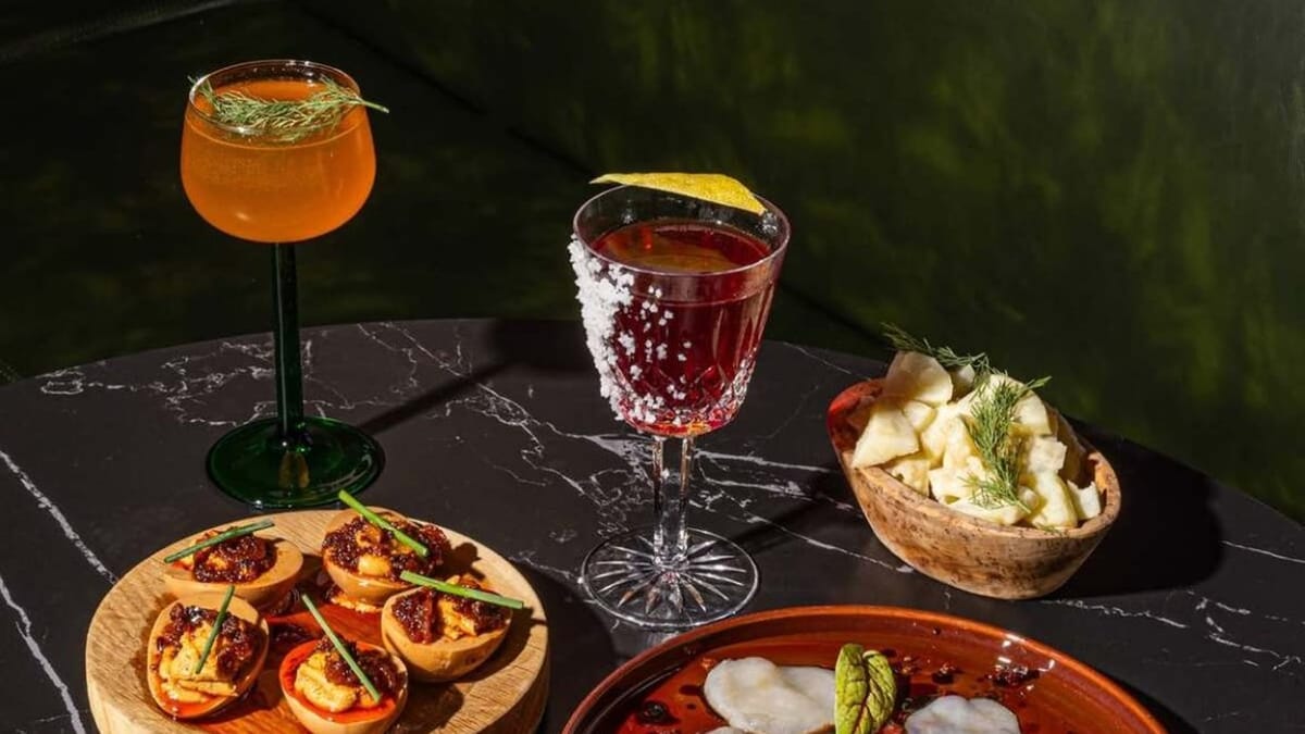 Coldbar-style cocktails with cold tapas including potato salad and garnished eggs