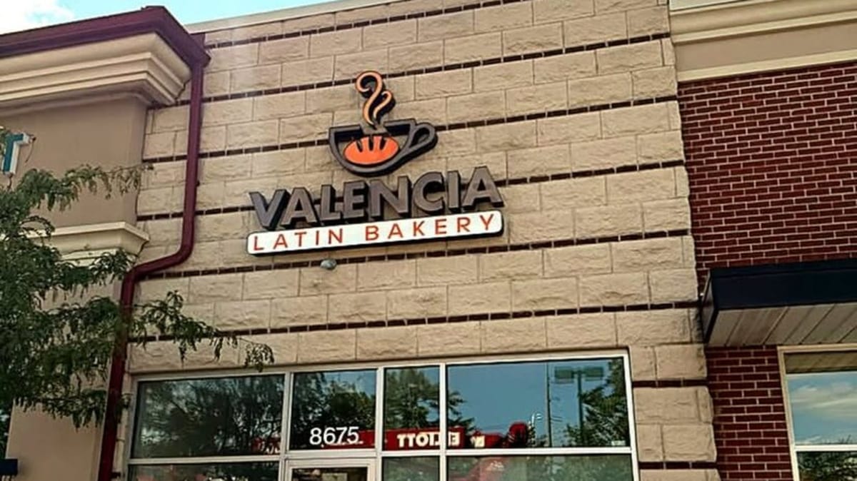 Valencia Latin Bakery storefront sign and glass entry at 8675 Sancus Blvd in Polaris