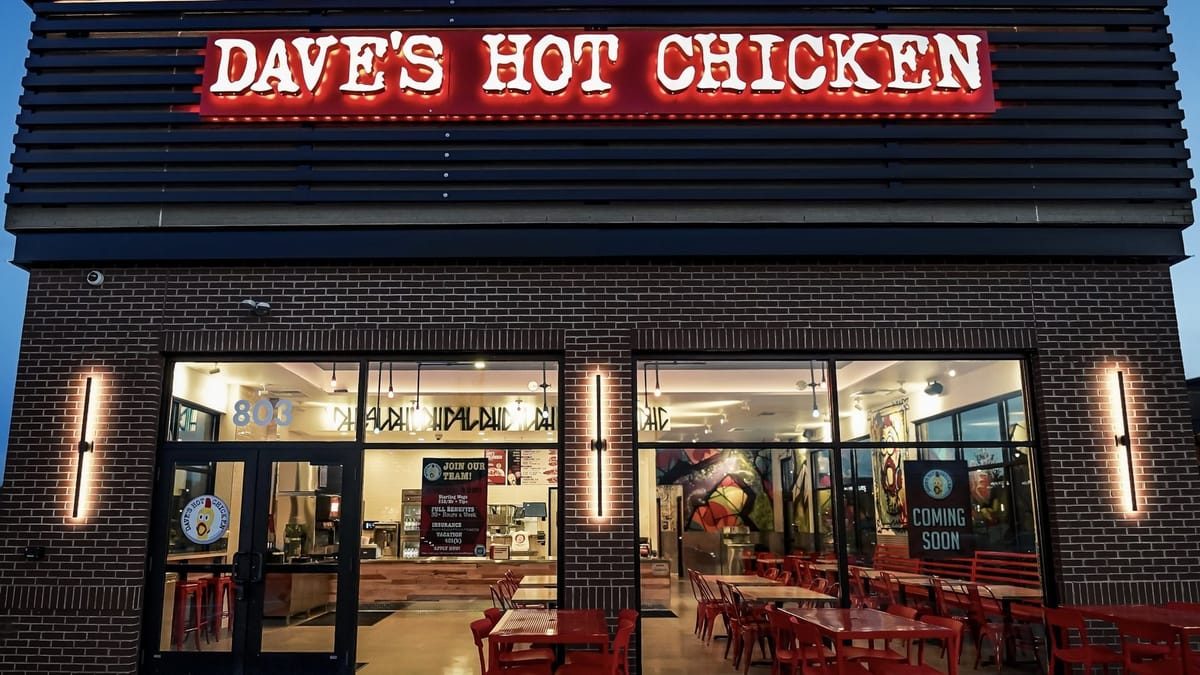 Dave's Hot Chicken storefront exterior at night