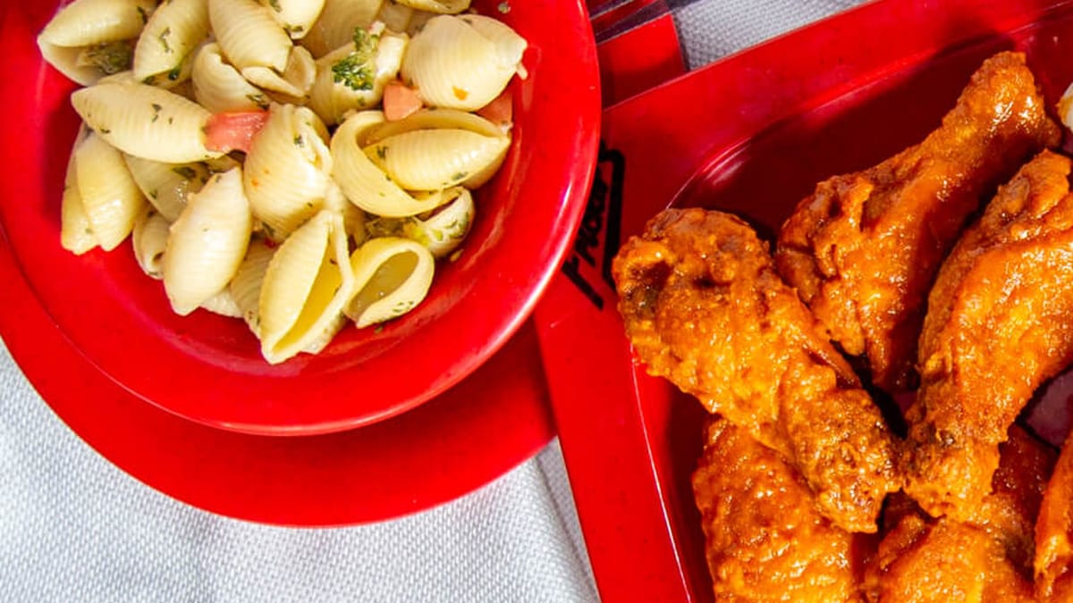 Fricker's bone-in buffalo wings on branded red tray