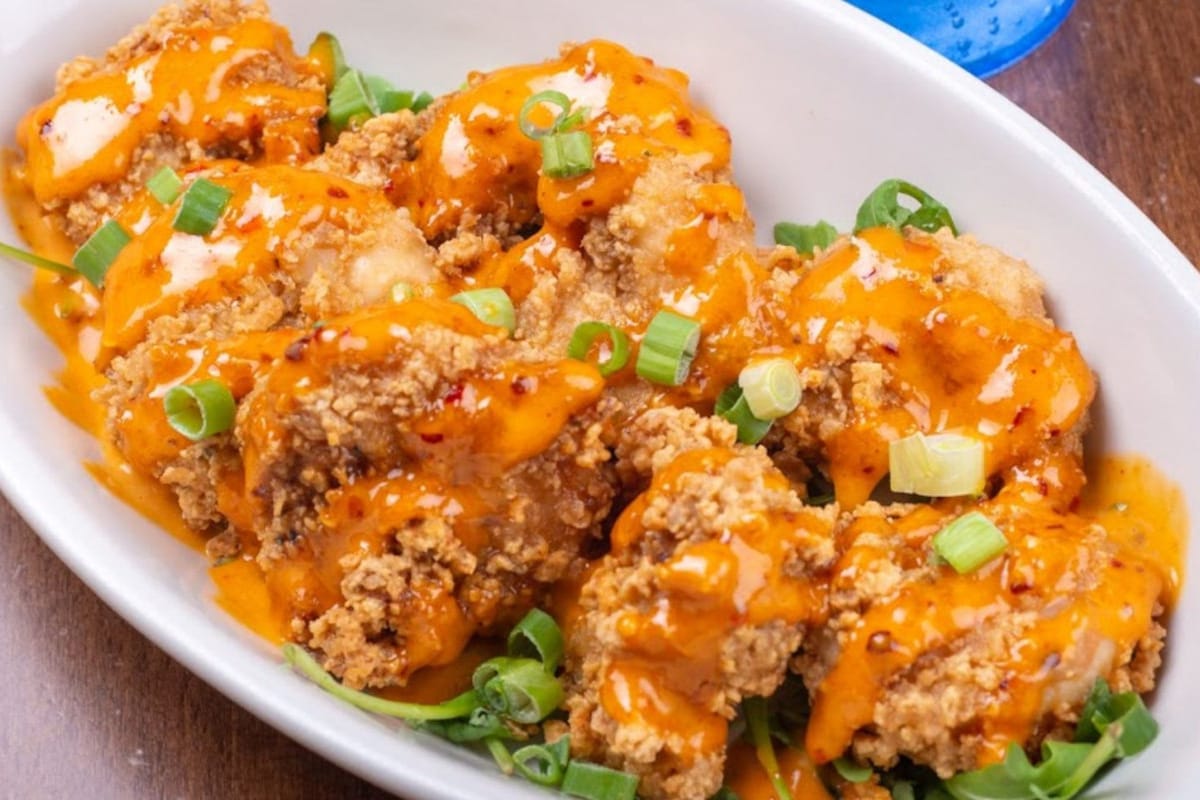Gallo's Tap Room fried chicken tenders with chili sauce and scallions