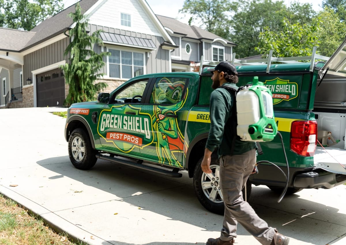 Green Shield Pest Pros technician and branded truck at a Columbus-area home. Photo: Green Shield Pest Pros