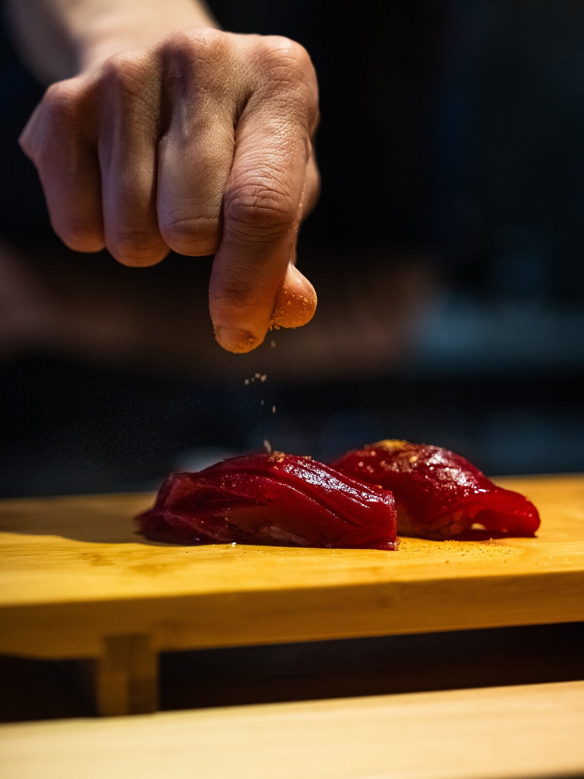 Chef seasoning nigiri at the Haru Omakase counter