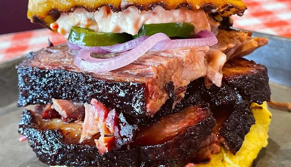 Sliced smoked brisket plated at Hoggy's BBQ