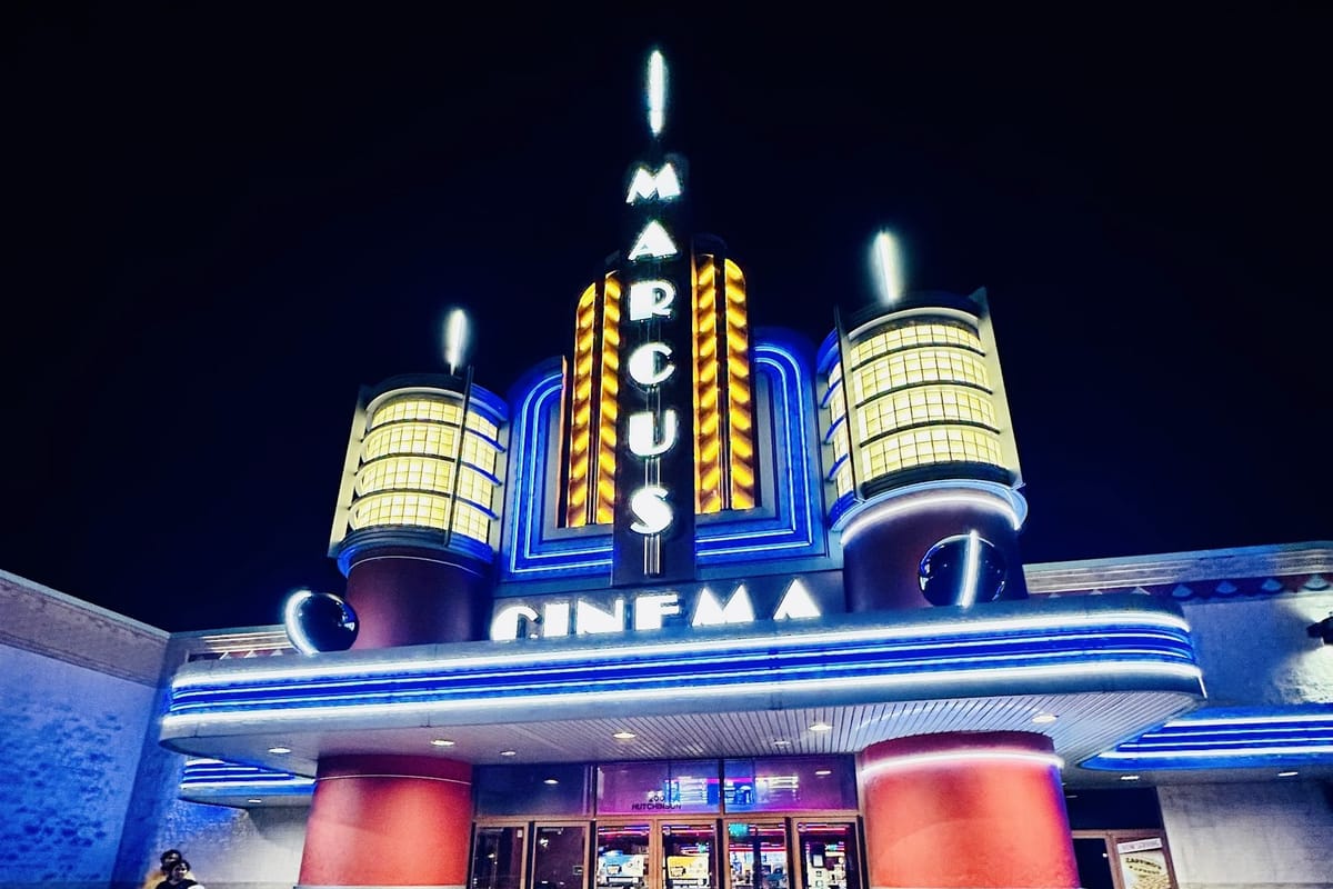 Marcus Crosswoods Cinema night entrance with lit marquee
