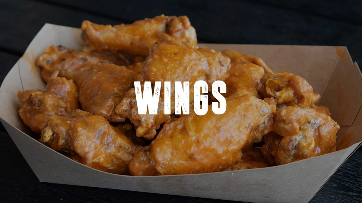 OX-B's bone-in buffalo wings in paper boat
