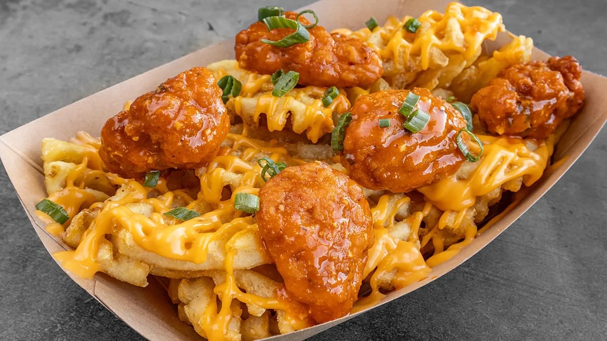 OX-B's boneless buffalo wings on cheese waffle fries