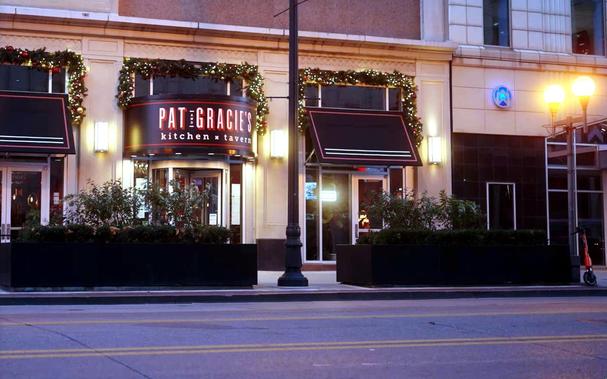 Pat & Gracie's storefront entrance at dusk
