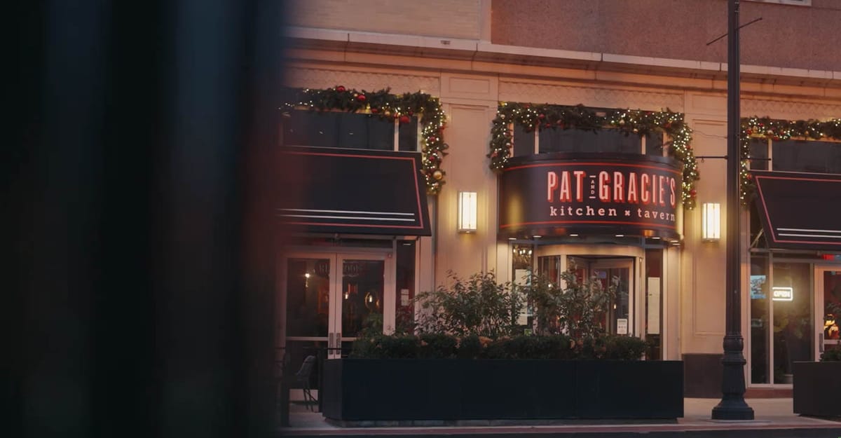Pat & Gracie's storefront neon and awnings