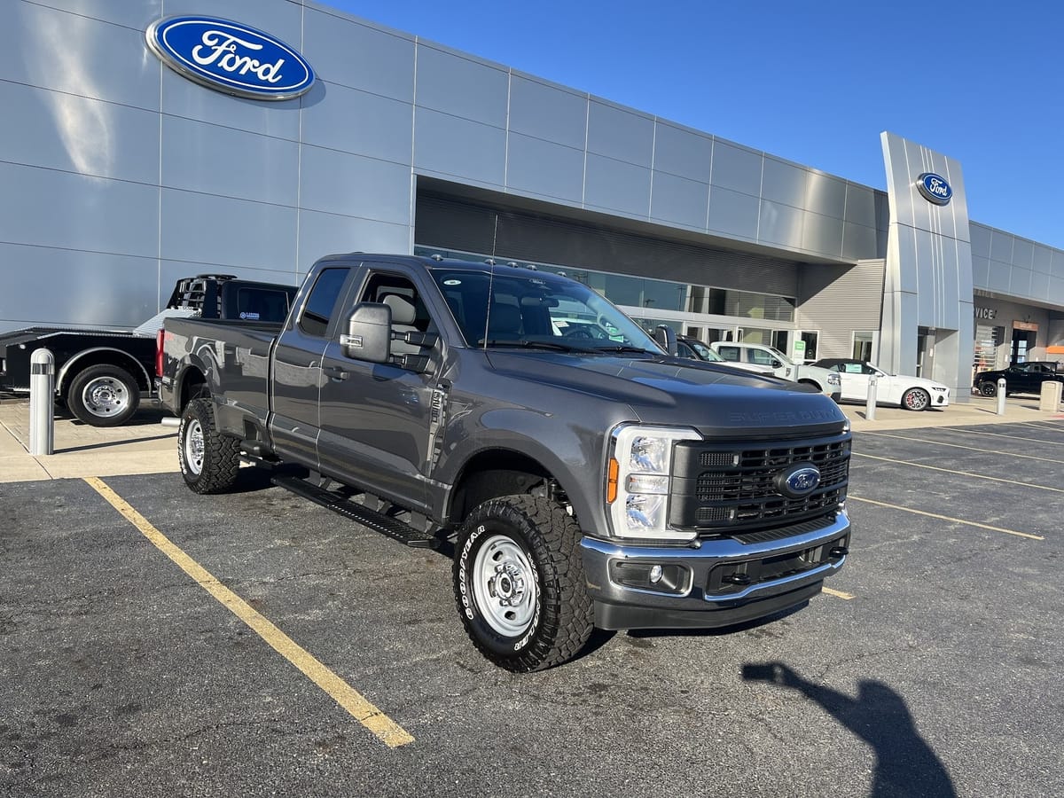 Ricart Ford showroom exterior with Ford Super Duty on the Groveport lot