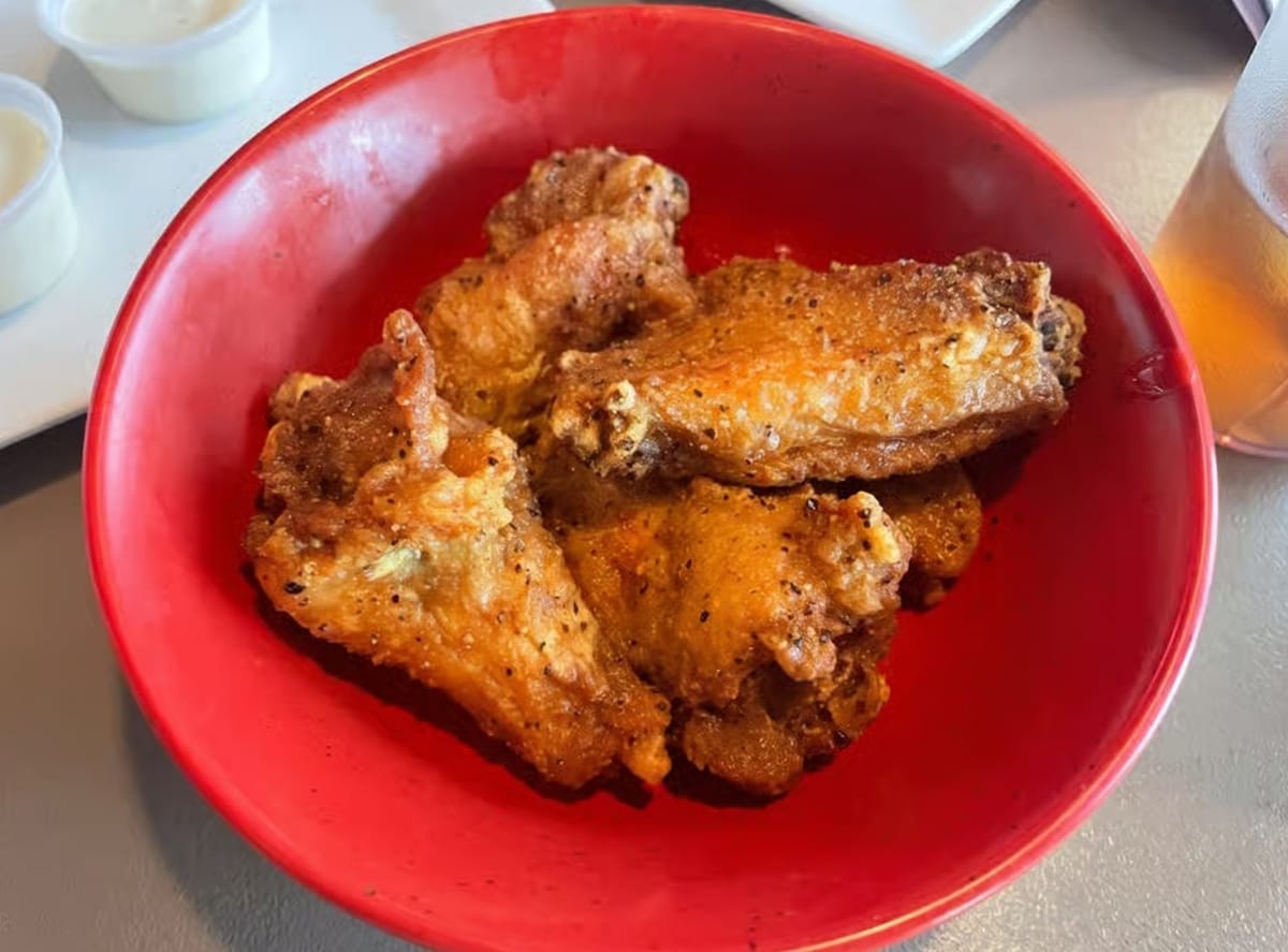 Roadhouse Wings & Grille fried wings in a red bowl