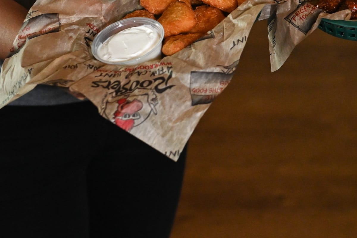 Roosters boneless wings in branded basket with ranch