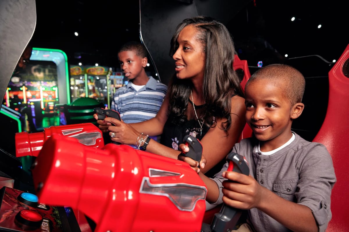 Family at the arcade floor inside Scene75 Columbus