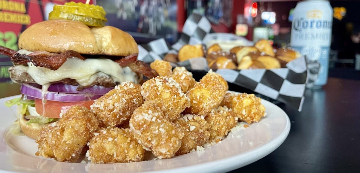 Pastimes Pub Grandview Yard burger plate in a trivia-friendly sports bar