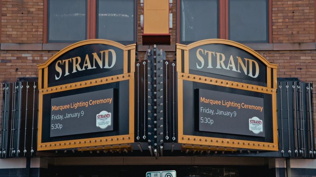 Strand Theatre night marquee in downtown Delaware