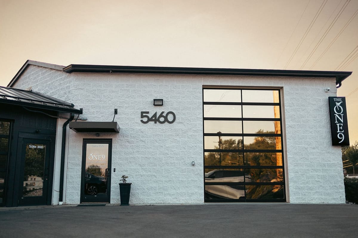 The One9 Hilliard storefront with THE ONE9 signage at golden hour