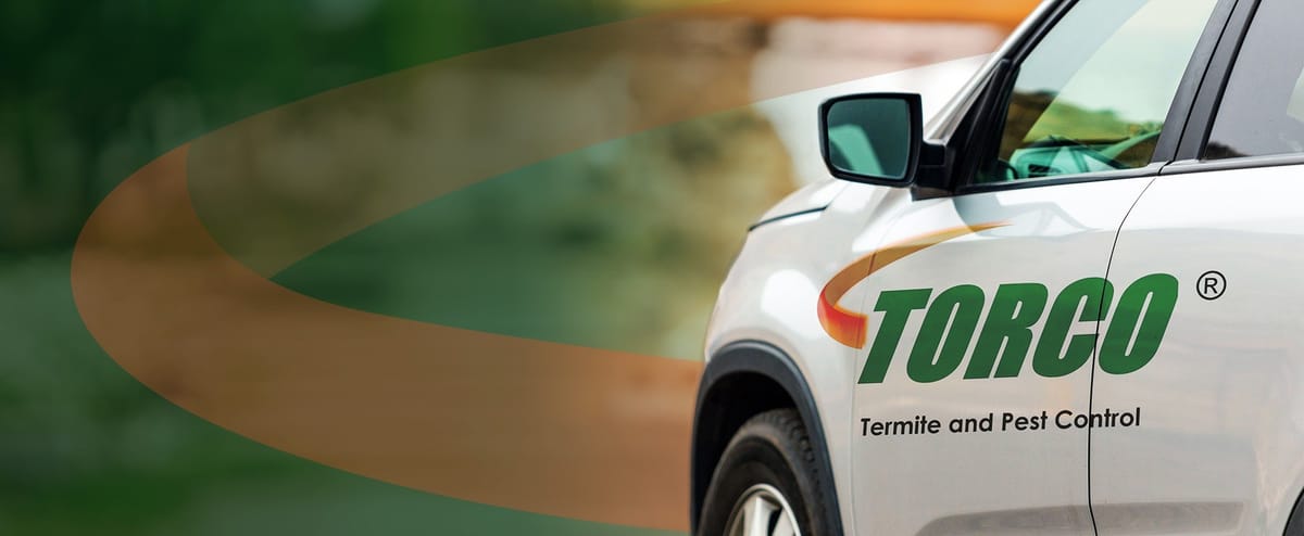 TORCO Termite and Pest Control branded white service vehicle