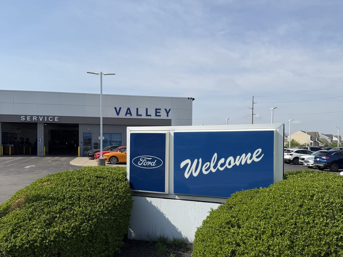 Valley Ford of Columbus welcome sign and VALLEY showroom facade on the west side lot
